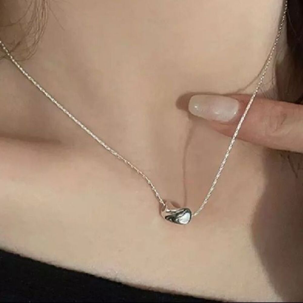 The Inverted Bean charm necklace in 925 silver.